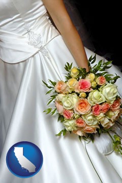 a bride, wearing a white wedding dress and holding a beautiful bridal bouquet - with California icon