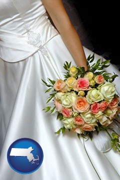a bride, wearing a white wedding dress and holding a beautiful bridal bouquet - with Massachusetts icon