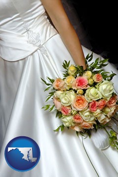 a bride, wearing a white wedding dress and holding a beautiful bridal bouquet - with Maryland icon